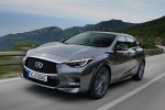 Picture of a driving 2019 Infiniti QX30 AWD in Graphite Shadow from a front left perspective