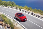 Picture of a driving 2018 Jaguar E-Pace P300 R-Dynamic AWD in Firenze Red Metallic from a front right perspective