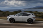 Picture of a driving 2018 Jaguar E-Pace P300 R-Dynamic AWD in Fuji White from a left side perspective