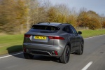 Picture of a driving 2018 Jaguar E-Pace P300 R-Dynamic AWD in Corris Gray from a rear right perspective
