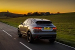 Picture of a driving 2018 Jaguar E-Pace P300 R-Dynamic AWD in Corris Gray from a rear perspective