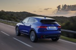 Picture of a driving 2018 Jaguar E-Pace P300 R-Dynamic AWD in Caesium Blue Metallic from a rear left perspective