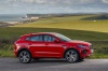 Picture of a 2019 Jaguar E-Pace P300 R-Dynamic AWD in Firenze Red Metallic from a right side perspective