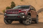 Picture of a 2017 Jeep Cherokee Trailhawk 4WD in Deep Cherry Red Crystal Pearlcoat from a front left perspective
