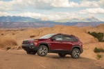 Picture of a 2017 Jeep Cherokee Trailhawk 4WD in Deep Cherry Red Crystal Pearlcoat from a front left three-quarter perspective