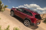 Picture of a 2017 Jeep Cherokee Trailhawk 4WD in Deep Cherry Red Crystal Pearlcoat from a rear left perspective