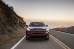 Picture of a driving 2017 Jeep Cherokee Latitude in Deep Cherry Red Crystal Pearlcoat from a frontal perspective
