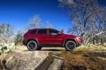 Picture of a 2017 Jeep Cherokee Trailhawk 4WD in Deep Cherry Red Crystal Pearlcoat from a side perspective