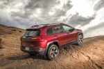Picture of a 2017 Jeep Cherokee Trailhawk 4WD in Deep Cherry Red Crystal Pearlcoat from a rear right three-quarter perspective