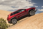 Picture of a 2017 Jeep Cherokee Trailhawk 4WD in Deep Cherry Red Crystal Pearlcoat from a side perspective