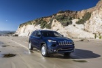 Picture of a driving 2017 Jeep Cherokee Limited 4WD from a front right perspective