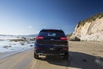 Picture of a driving 2017 Jeep Cherokee Limited 4WD from a rear perspective