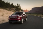 Picture of a driving 2018 Jeep Cherokee Latitude in Red from a front left perspective