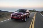 Picture of a driving 2018 Jeep Cherokee Latitude in Red from a front left three-quarter perspective