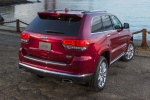 Picture of a 2014 Jeep Grand Cherokee Summit 4WD in Deep Cherry Red Crystal Pearlcoat from a rear right perspective