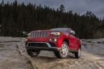 Picture of a 2014 Jeep Grand Cherokee Summit 4WD in Deep Cherry Red Crystal Pearlcoat from a front left three-quarter perspective