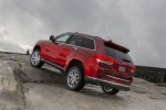 Picture of a 2014 Jeep Grand Cherokee Summit 4WD in Deep Cherry Red Crystal Pearlcoat from a rear left three-quarter perspective