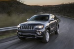 Picture of a driving 2014 Jeep Grand Cherokee Limited Diesel 4WD in Granite Crystal Metallic Clearcoat from a front left three-quarter perspective