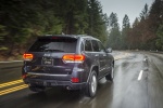Picture of a driving 2014 Jeep Grand Cherokee Limited Diesel 4WD in Granite Crystal Metallic Clearcoat from a rear right perspective
