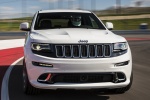 Picture of a driving 2014 Jeep Grand Cherokee SRT 4WD in Bright White Clear Coat from a frontal perspective