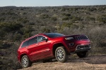 Picture of a 2014 Jeep Grand Cherokee Summit 4WD in Deep Cherry Red Crystal Pearlcoat from a front right three-quarter perspective