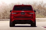 Picture of a 2015 Jeep Grand Cherokee SRT 4WD in Redline 2 Coat Pearl from a rear perspective