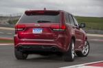 Picture of a 2015 Jeep Grand Cherokee SRT 4WD in Redline 2 Coat Pearl from a rear right perspective