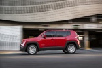 Picture of a driving 2016 Jeep Renegade Latitude 4WD in Colorado Red from a side perspective