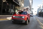Picture of a driving 2017 Jeep Renegade Latitude 4WD in Colorado Red from a frontal perspective