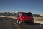 Picture of a driving 2018 Jeep Renegade Latitude 4WD in Colorado Red from a rear perspective