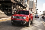 Picture of a driving 2018 Jeep Renegade Latitude 4WD in Colorado Red from a front left perspective