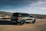 Picture of a driving 2020 Kia Telluride AWD in Dark Moss from a rear right three-quarter perspective
