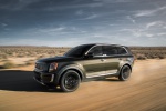 Picture of a driving 2020 Kia Telluride AWD in Dark Moss from a front left three-quarter perspective