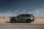 Picture of a driving 2020 Kia Telluride AWD in Dark Moss from a side perspective