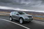 Picture of a driving 2015 Land Rover Discovery Sport HSE Luxury in Scotia Gray Metallic from a front right three-quarter perspective