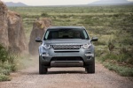 Picture of a driving 2015 Land Rover Discovery Sport HSE Luxury in Scotia Gray Metallic from a frontal perspective