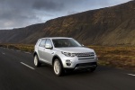 Picture of a driving 2015 Land Rover Discovery Sport HSE Luxury in Indus Silver Metallic from a front right perspective