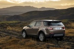 Picture of a driving 2019 Land Rover Discovery Sport HSE Luxury from a rear left three-quarter perspective