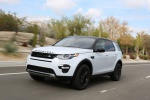 Picture of a driving 2019 Land Rover Discovery Sport HSE Luxury in Fuji White from a front left three-quarter perspective
