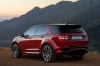 Picture of a 2020 Land Rover Discovery Sport P290 HSE R-Dynamic in Firenze Red Metallic from a rear left three-quarter perspective