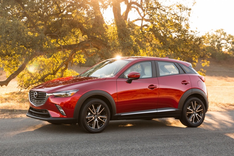 Picture of a 2016 Mazda CX-3 in Soul Red Metallic from a side perspective
