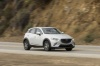 Picture of a driving 2016 Mazda CX-3 AWD in Crystal White Pearl Mica from a front right three-quarter perspective