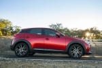 Picture of a 2017 Mazda CX-3 in Soul Red Metallic from a side perspective