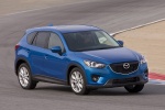 Picture of a driving 2014 Mazda CX-5 in Sky Blue Mica from a front right three-quarter perspective