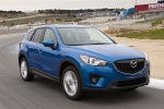 Picture of a driving 2014 Mazda CX-5 in Sky Blue Mica from a front right perspective