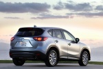 Picture of a 2014 Mazda CX-5 in Liquid Silver Metallic from a rear right three-quarter perspective