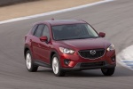 Picture of a driving 2014 Mazda CX-5 from a front right perspective