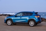 Picture of a 2014 Mazda CX-5 in Sky Blue Mica from a rear left three-quarter perspective