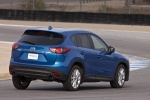 Picture of a driving 2015 Mazda CX-5 in Sky Blue Mica from a rear right three-quarter perspective