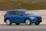 Picture of a driving 2015 Mazda CX-5 in Sky Blue Mica from a front right three-quarter perspective